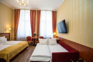 Postel nebo postele na pokoji v ubytování Pension Opera Suites I Self Check In