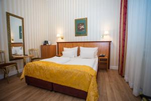 Postel nebo postele na pokoji v ubytování Pension Opera Suites I Self Check In