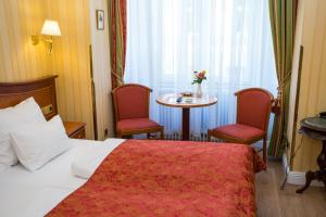 Postel nebo postele na pokoji v ubytování Pension Opera Suites I Self Check In