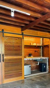 a wooden garage door in a room with a kitchen at Langkawi Signature Resort in Pantai Cenang