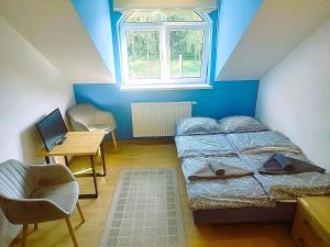 Łóżko lub łóżka w pokoju w obiekcie Zajazd u Hermanów