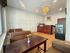 a living room with a couch and a table at The Clove Ladakh in Leh