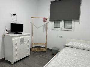 Posteľ alebo postele v izbe v ubytovaní Santa Rita