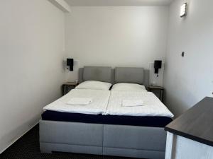Postel nebo postele na pokoji v ubytování Apartmán Hugo