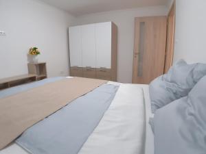 Posteľ alebo postele v izbe v ubytovaní Apartman Veiger 3