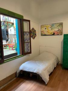 Postel nebo postele na pokoji v ubytování Art Hostel Casa Chaman