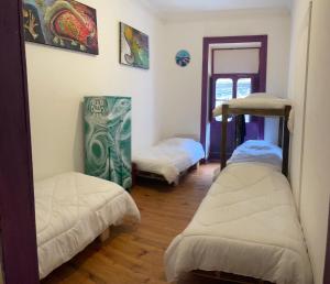 Postel nebo postele na pokoji v ubytování Art Hostel Casa Chaman