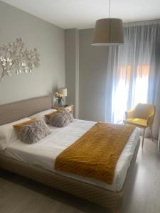 Ένα ή περισσότερα κρεβάτια σε δωμάτιο στο EH - Apartamentos Heroísmo