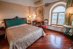Postel nebo postele na pokoji v ubytování Hotel Fortuna