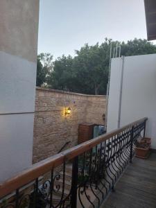 a balcony with a stone wall and a gate at Hotel Valide Hanim Konak in Lefkosa Turk