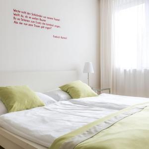 Łóżko lub łóżka w pokoju w obiekcie Hotel Villa Rückert