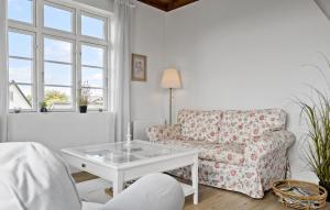 a living room with a couch and a coffee table at Two-Bedroom Holiday Home In Ringkobing in Ringkøbing