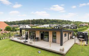 an overhead view of a house with a large deck at 3 Bedroom Lovely Home In Sjølund in Sjølund +15 photos