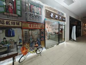 a bike is on the wall of a store at Sutera Avenue Rooftop Infinity Pool KK Infini Stay in Kota Kinabalu