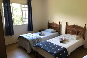 Katil atau katil-katil dalam bilik di Sitio com Piscina AQUECIDa e 5 quartos c/ suíte!