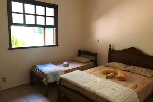 Katil atau katil-katil dalam bilik di Sitio com Piscina AQUECIDa e 5 quartos c/ suíte!