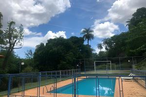 Kolam renang di atau dekat dengan Sitio com Piscina AQUECIDa e 5 quartos c/ suíte!