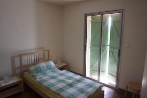 a small bedroom with a bed and a window at Presqu`ile de Giens in Hyères +20 photos