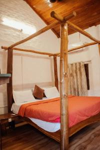 Postel nebo postele na pokoji v ubytování Earthome Pilibhit Tiger Reserve