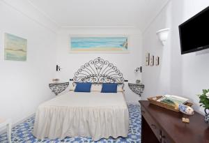 A bed or beds in a room at Il Giardino dell'Arte