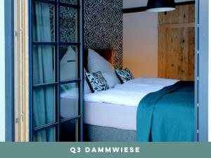 a bedroom with a bed and a glass door at Dachstein 7 in Gosau