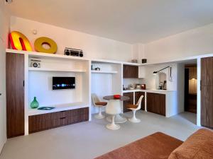 a living room with a small table and chairs at casanu in Ostuni +34 photos