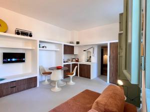 a living room with a couch and a table at casanu in Ostuni