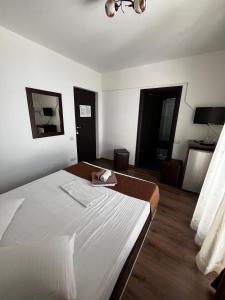 Postel nebo postele na pokoji v ubytování Elegance