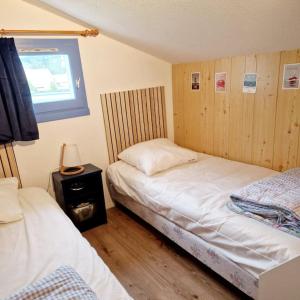 En eller flere senge i et værelse på La Parenthèse