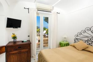 A bed or beds in a room at Il Giardino dell'Arte