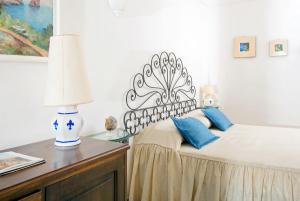 A bed or beds in a room at Il Giardino dell'Arte