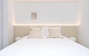 Nathan's Suites On The Beach客房内的一张或多张床位