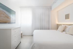 Nathan's Suites On The Beach客房内的一张或多张床位