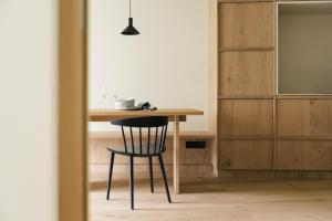a table and a chair in a room at Boutique Hotel Pachers in Bressanone