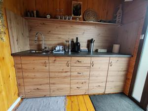 a kitchen with a sink and a counter top at Glamping ZAZEN in Drumu Carului