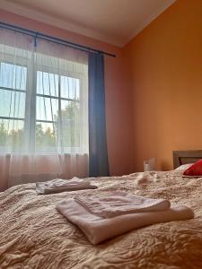 Postel nebo postele na pokoji v ubytování Laguna House