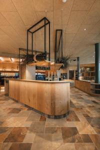 a restaurant with a reception desk in a building at Boutique Hotel Pachers in Bressanone