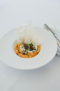 a plate of food with rice on a table at Boutique Hotel Pachers in Bressanone