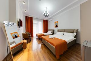 Postel nebo postele na pokoji v ubytování Sun Wine Hotel
