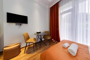TV a/nebo společenská místnost v ubytování Sun Wine Hotel