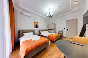 Postel nebo postele na pokoji v ubytování Sun Wine Hotel