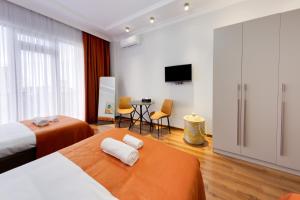 Postel nebo postele na pokoji v ubytování Sun Wine Hotel
