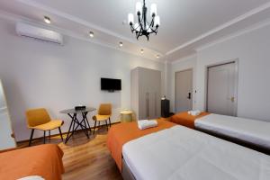 Postel nebo postele na pokoji v ubytování Sun Wine Hotel