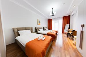 Postel nebo postele na pokoji v ubytování Sun Wine Hotel