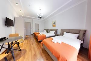 TV a/nebo společenská místnost v ubytování Sun Wine Hotel