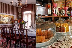 a dining room with a table with chairs and a large vase at Rose Manor Bed & Breakfast in New Orleans