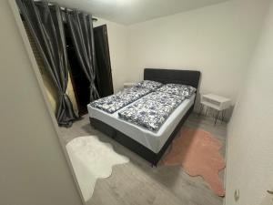 a view of a bedroom with a bed and a mirror at Apartment Alisha in Cazin
