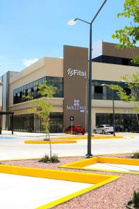 a building with a street light in front of it at Fairfield Inn & Suites by Marriott Aguascalientes in Aguascalientes