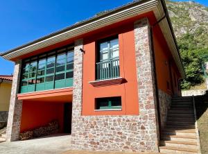 a house with an orange at Roca de Guía Somiedo in Pola de Somiedo