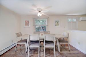 a dining room with a table and chairs at Walk to Nauset Beach NEW AC System in Orleans +22 photos